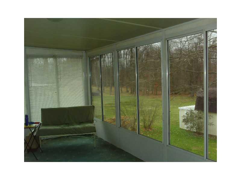 116 Hoy Street Rices Landing, PA 15357 - Photo 7 of 11 Sunroom. glass enclosed sun room