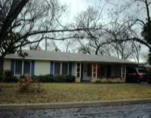 6006 Cary Drive Austin, TX 78757 - Photo 1 of 1 a view of a white house with large windows and a small yard