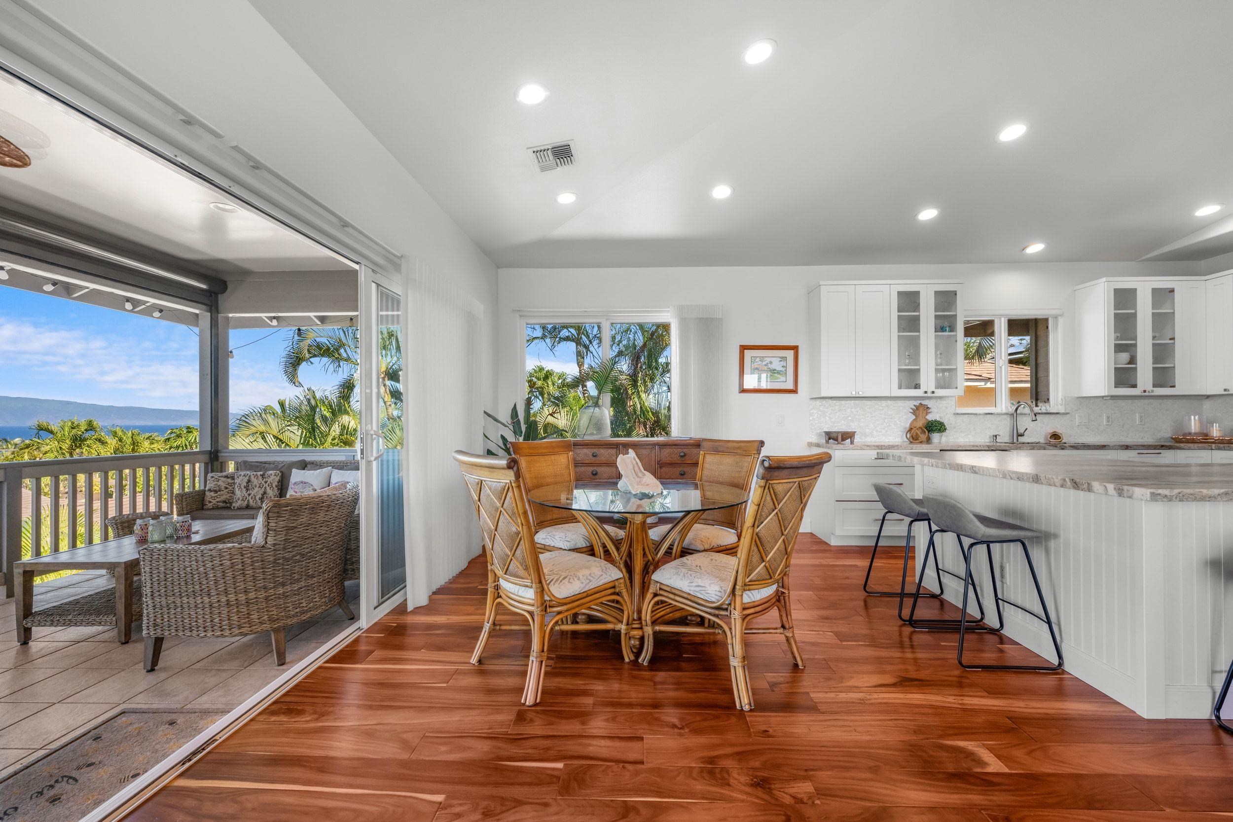 125 Kahana Makai Road Lahaina, HI 96761 - Photo 11 of 46 a view of a dining room with furniture and wooden floor