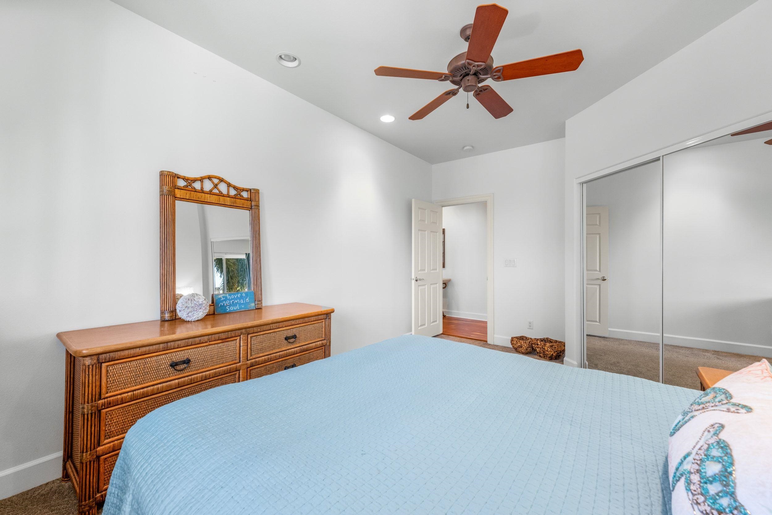 125 Kahana Makai Road Lahaina, HI 96761 - Photo 27 of 46 a bedroom with a bed and a dresser in it