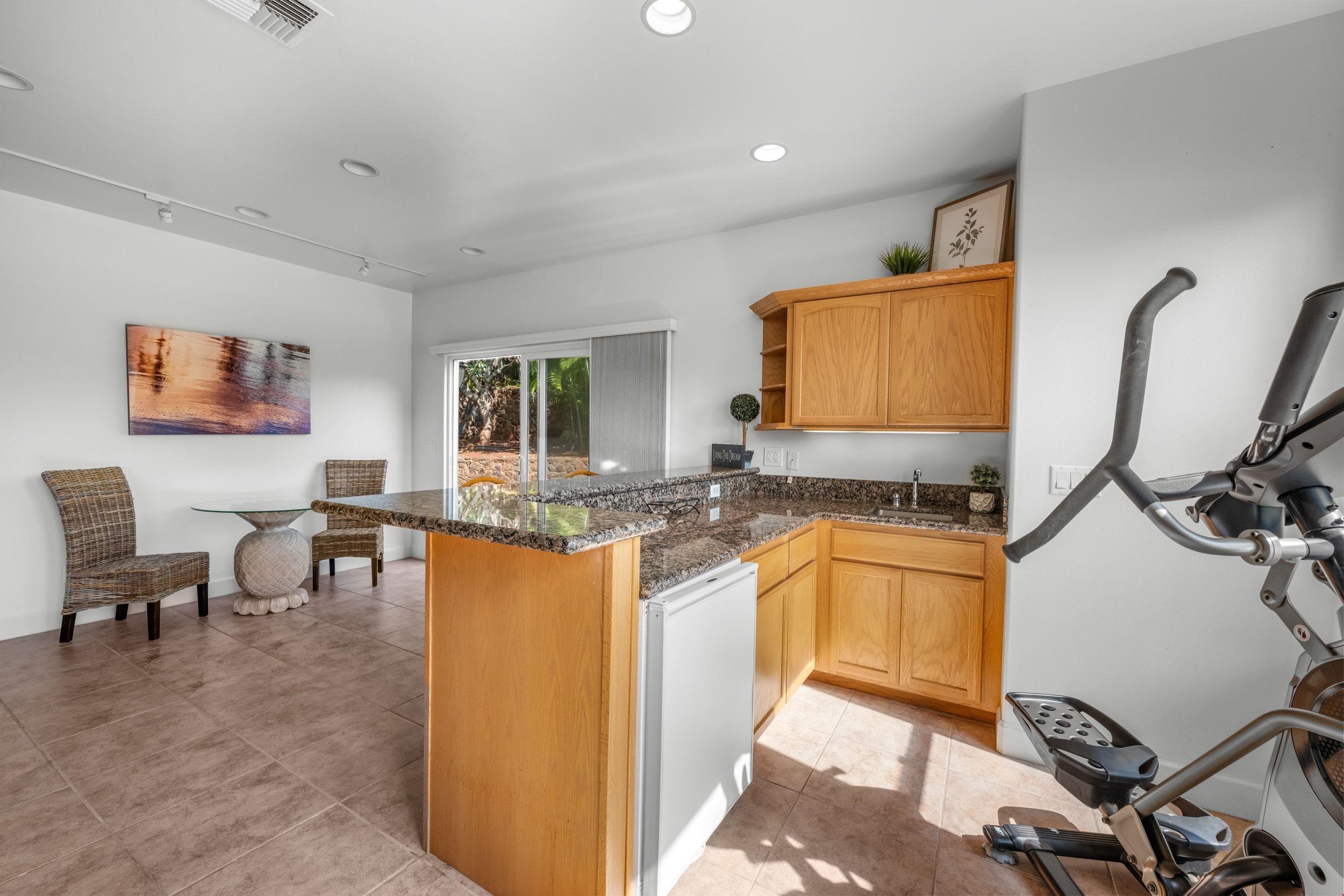 125 Kahana Makai Road Lahaina, HI 96761 - Photo 32 of 46 a kitchen with stainless steel appliances granite countertop sink and cabinets