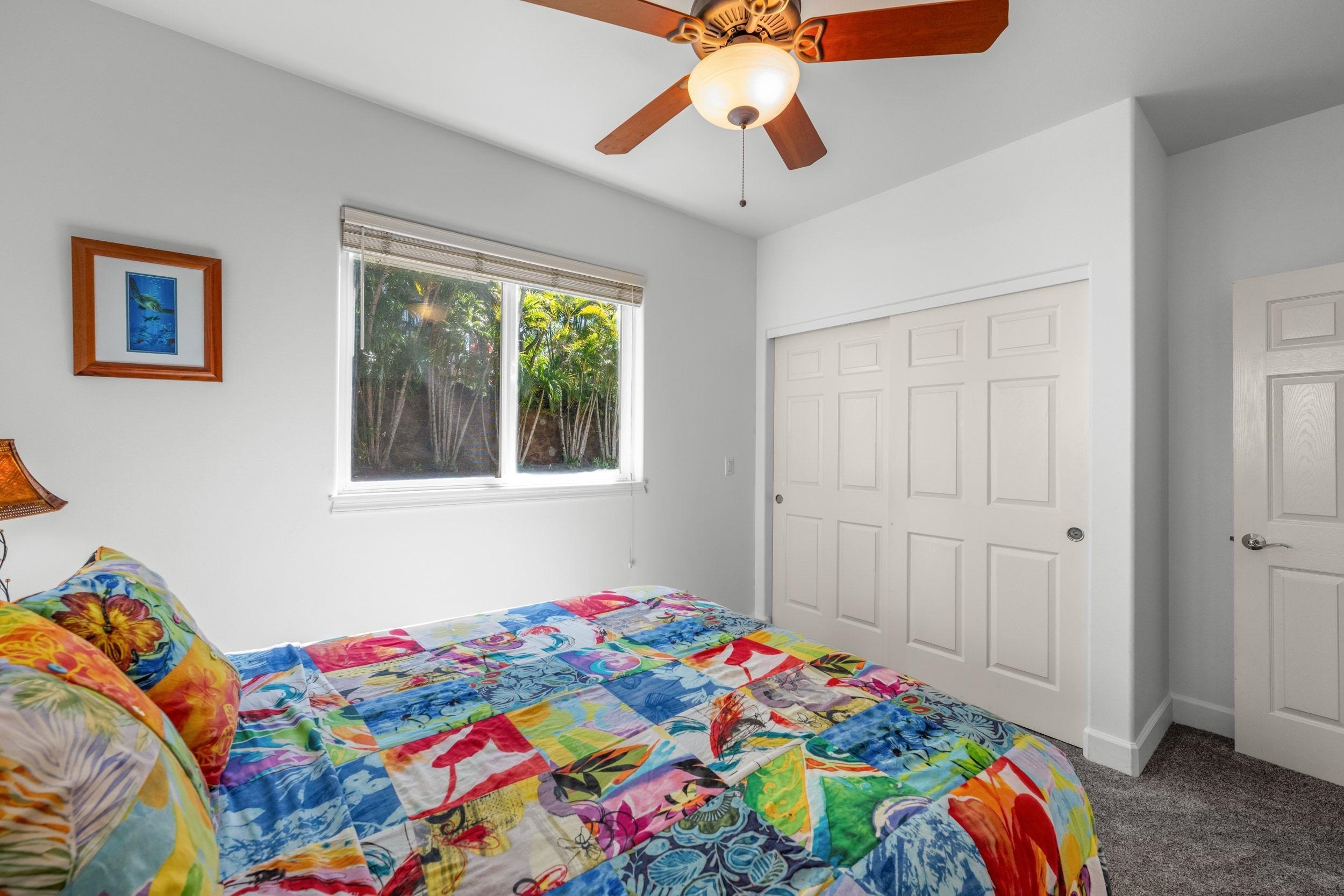 125 Kahana Makai Road Lahaina, HI 96761 - Photo 35 of 46 a bedroom with a bed and a painting on the wall
