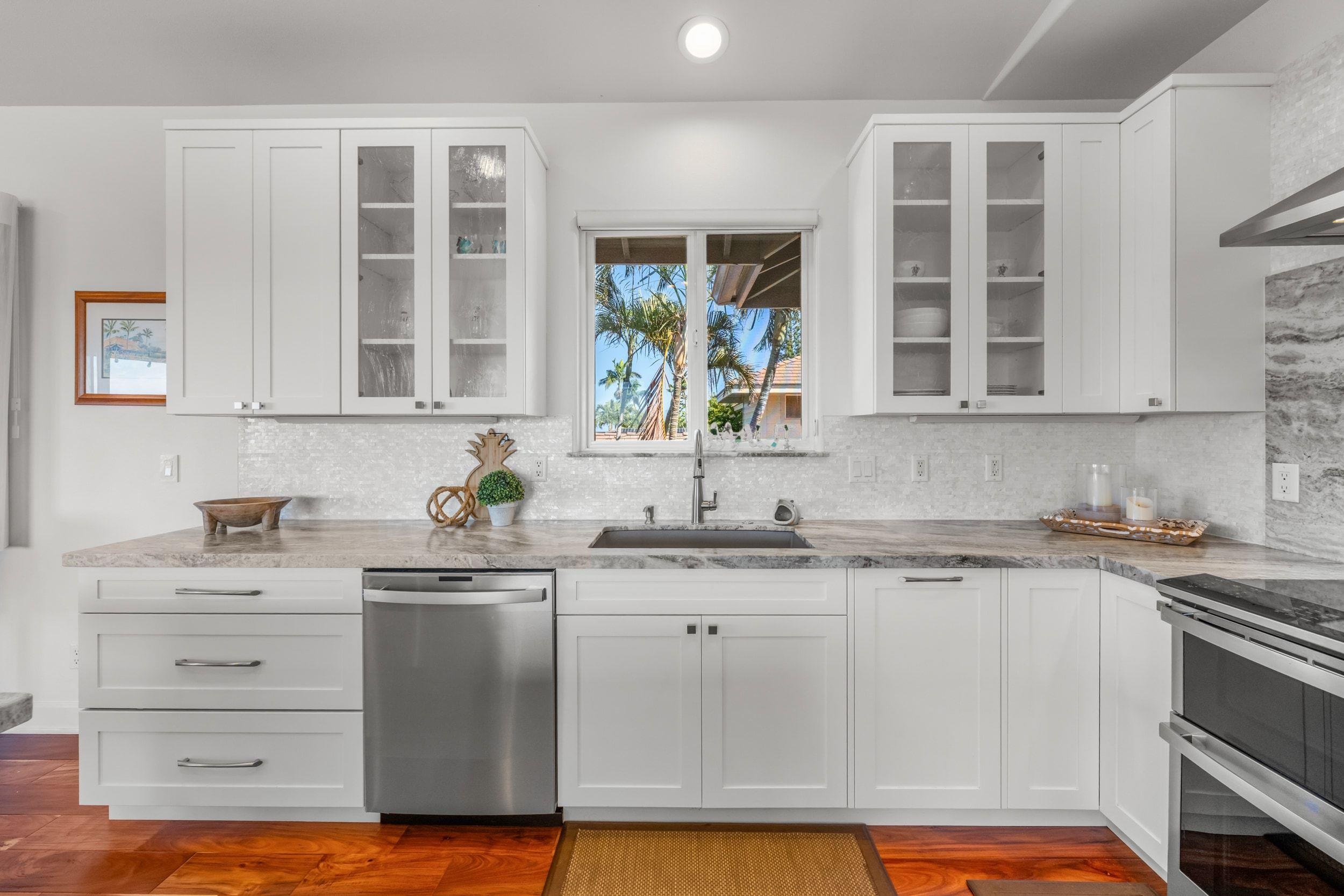 125 Kahana Makai Road Lahaina, HI 96761 - Photo 6 of 46 a kitchen with stainless steel appliances granite countertop a sink stove and cabinets