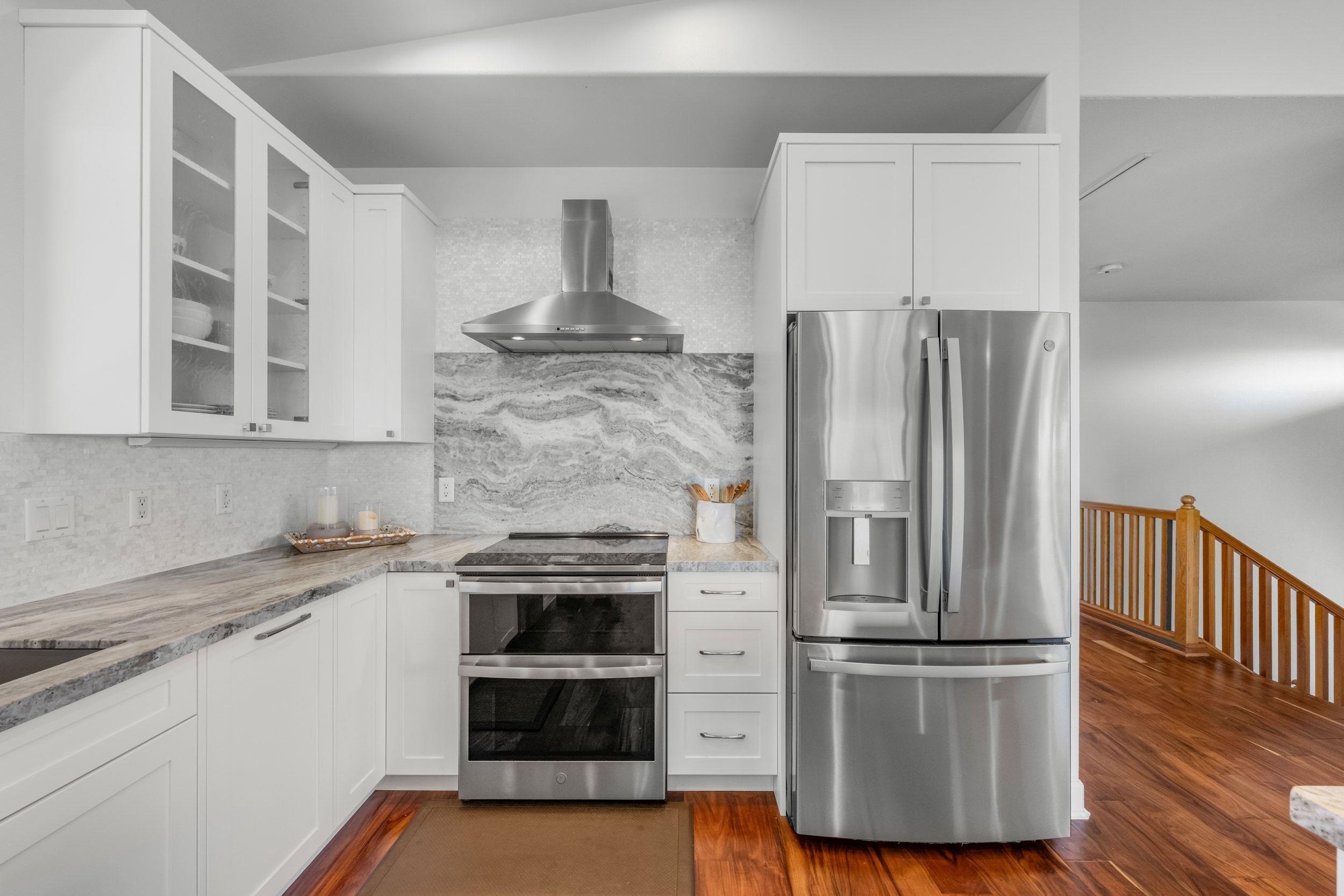 125 Kahana Makai Road Lahaina, HI 96761 - Photo 7 of 46 a kitchen with a refrigerator and a sink