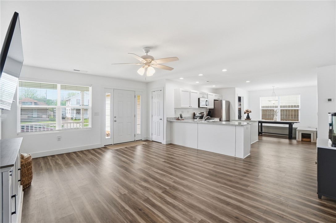 728 East Northern Avenue Springfield, OH 45503 - Photo 8 of 35 This bright and airy open concept living area seamlessly connects to a modern kitchen and dining space.