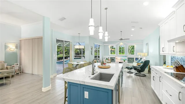 a view of a kitchen and dining room with wooden floor windows