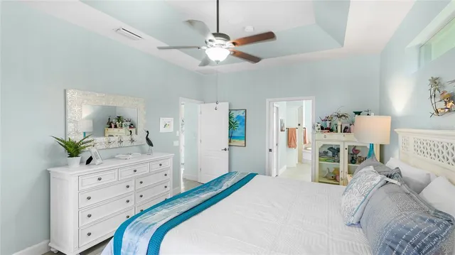 a bedroom with a bed and a dresser in it