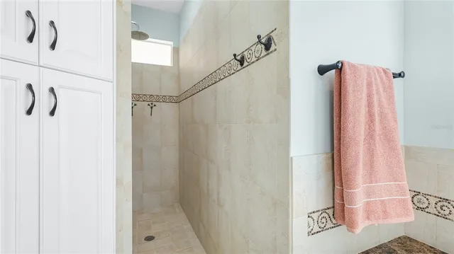 a bathroom with a shower and a shower curtain