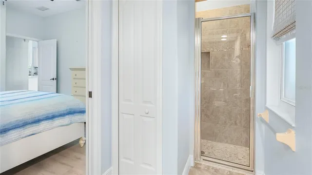 a bathroom with a granite countertop shower mirror and a sink