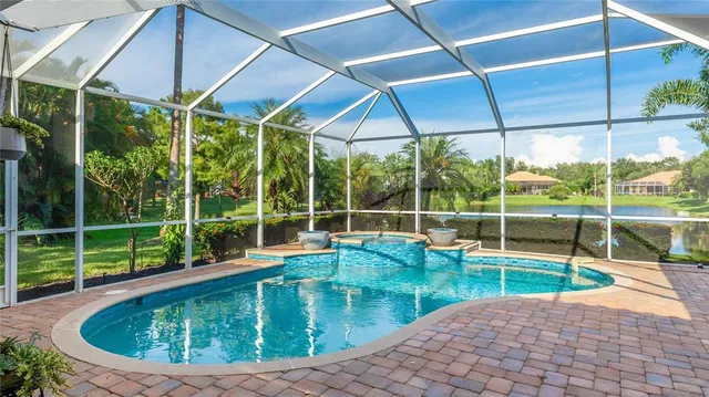 a view of a backyard with swimming pool