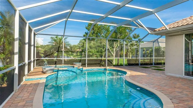 a view of a swimming pool with a patio