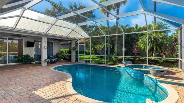 a view of a backyard with swimming pool