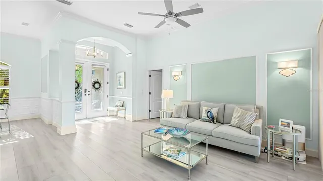 a living room with furniture and wooden floor