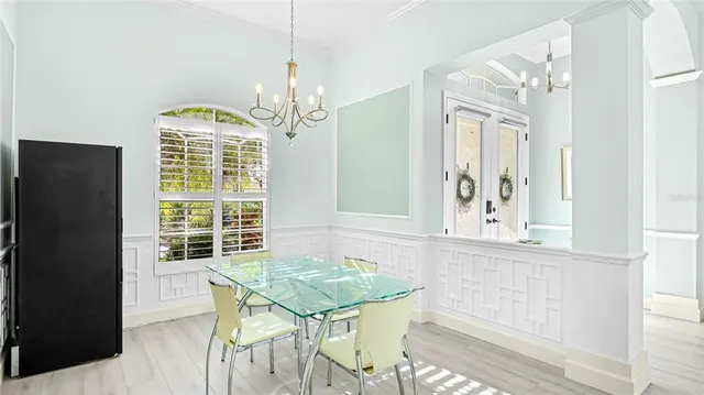 a view of a dining room with furniture and window