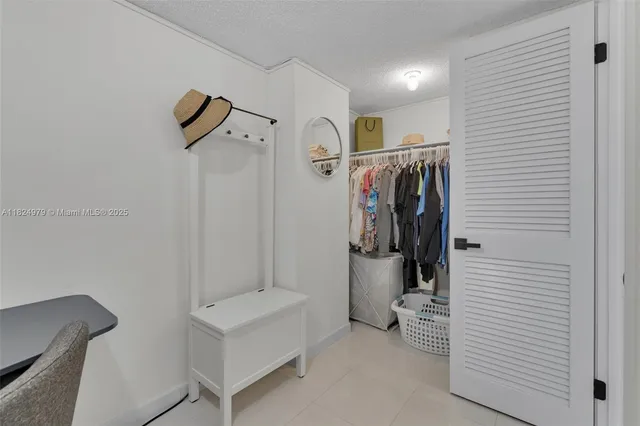 a spacious bathroom with a granite countertop sink mirror and double