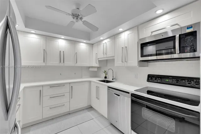 a living room with furniture a rug and a flat screen tv