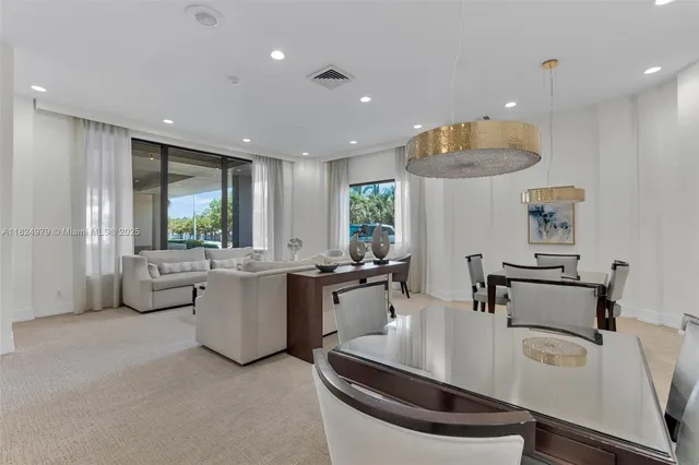 a large white kitchen with a large window