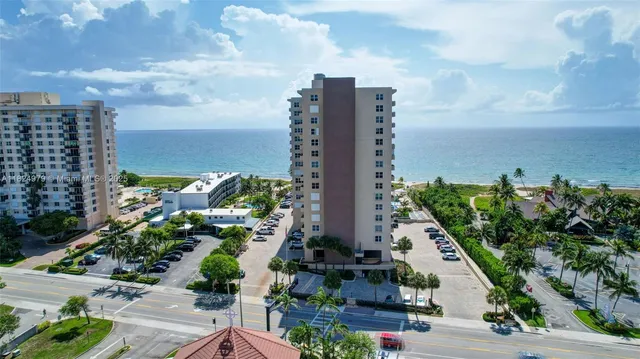 an aerial view of residential building and lake view