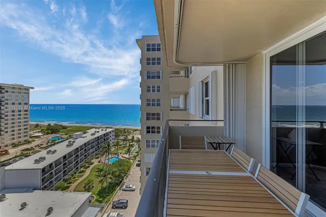 a view of roof deck with two chairs and wooden floor