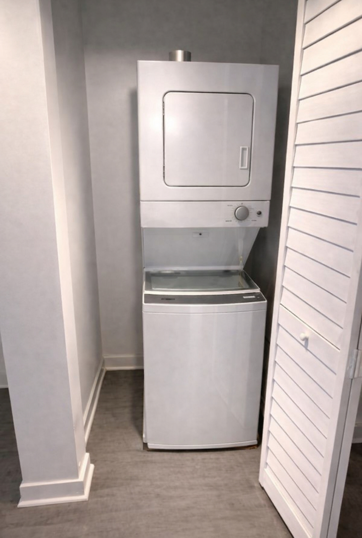 4519 West Thomas Street, Unit 1 Chicago, IL 60651 - Photo 4 of 6 a utility room with wooden floor washer and dryer