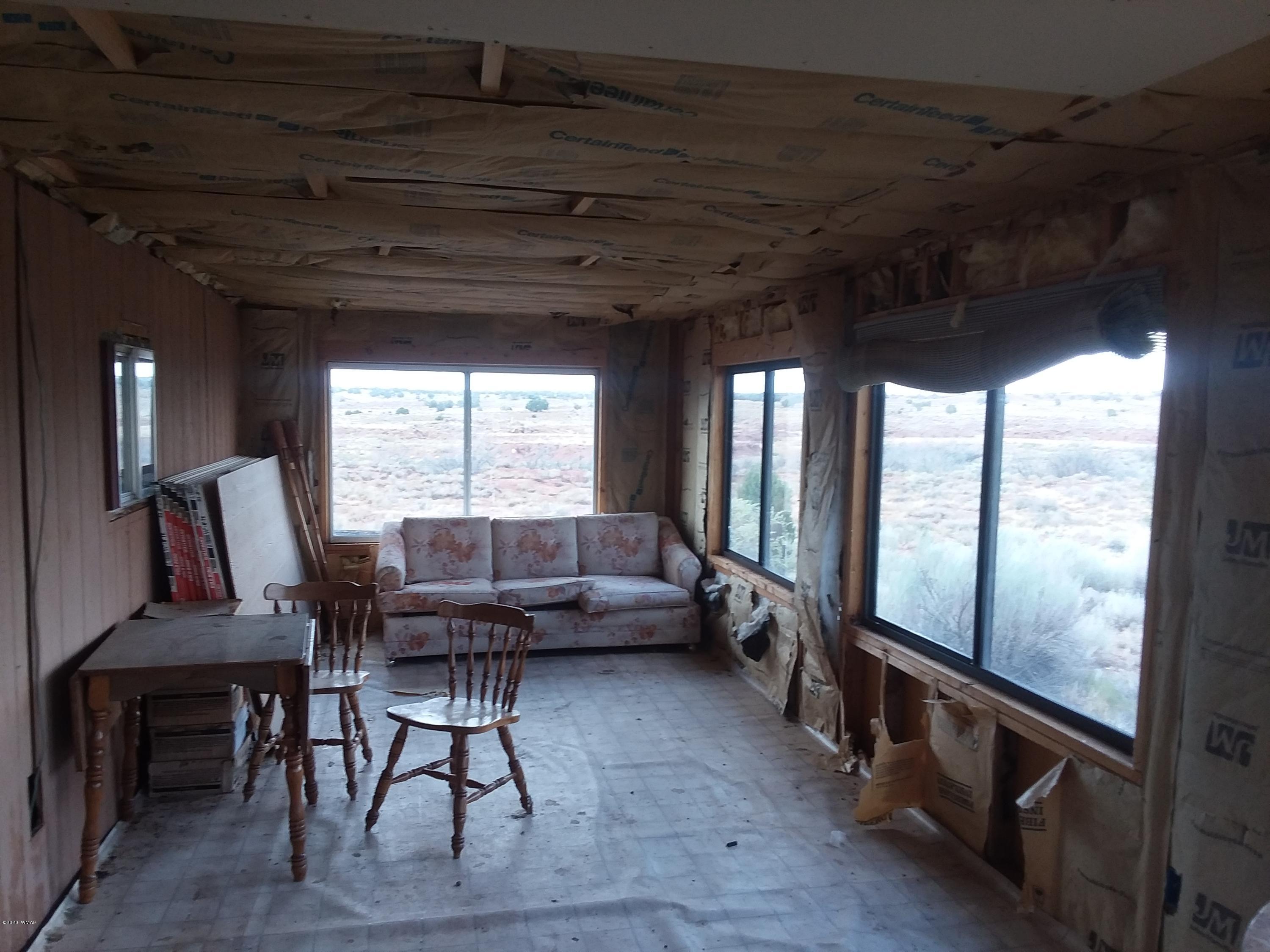 Lot 361 Woodridge Ranch, Unit 9 Concho, AZ 85924 - Photo 19 of 22 a living room with furniture and a large window