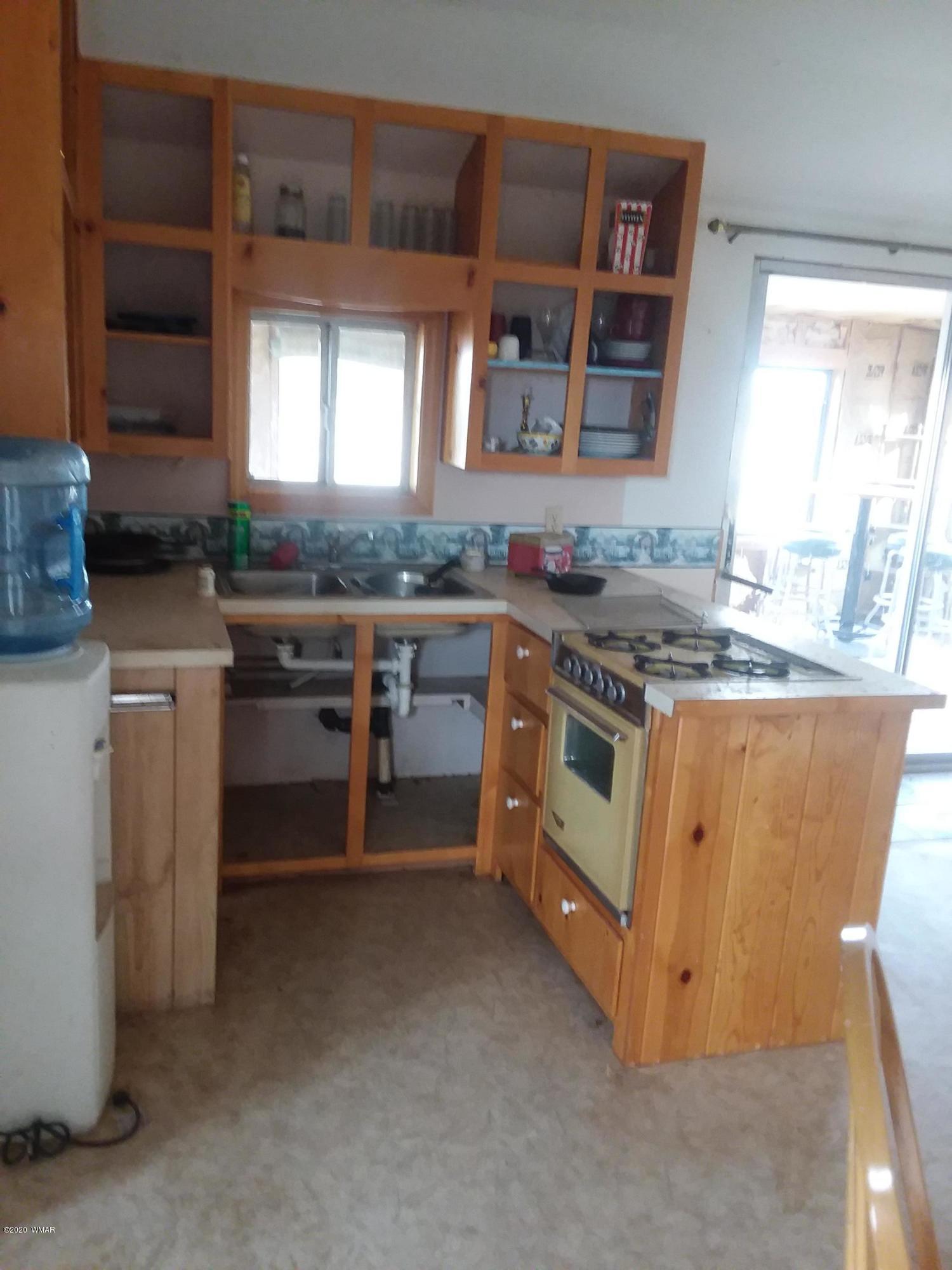 Lot 361 Woodridge Ranch, Unit 9 Concho, AZ 85924 - Photo 6 of 22 a kitchen with a stove and a sink