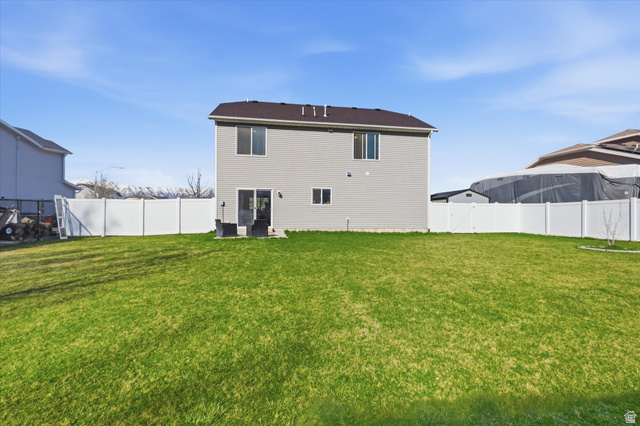 1084 South 740 East Logan, UT 84321 - Photo 16 of 23 Rear view of property with a fenced backyard