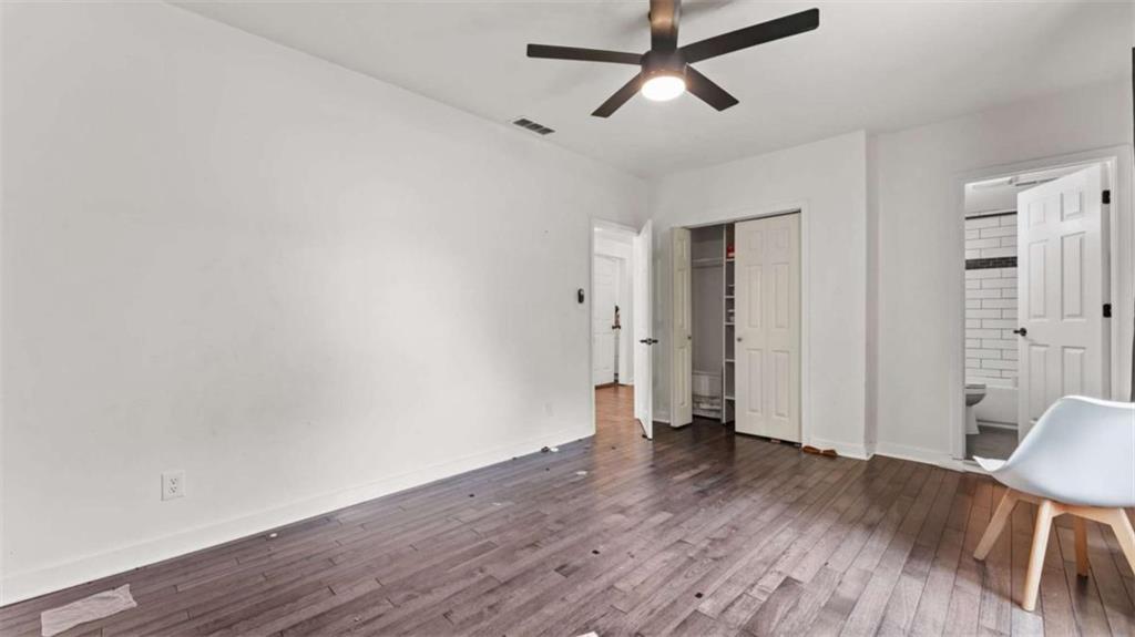 5491 Hill Road Southwest Powder Springs, GA 30127 - Photo 14 of 22 a view of empty room with wooden floor and window