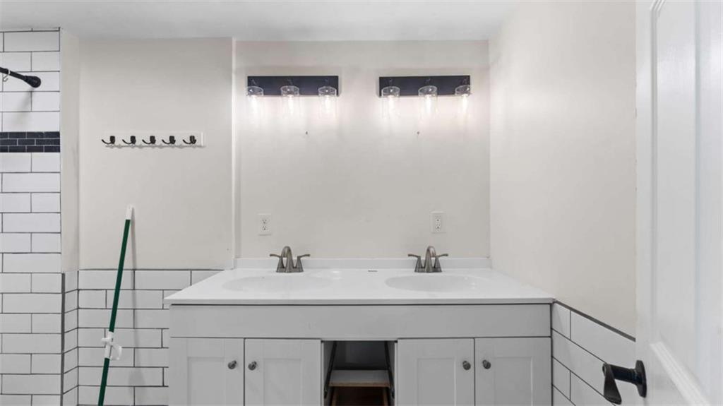 5491 Hill Road Southwest Powder Springs, GA 30127 - Photo 17 of 22 a bathroom with a sink and mirror