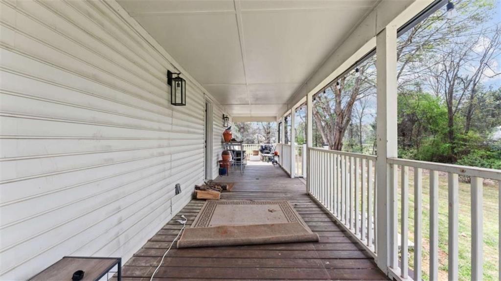 5491 Hill Road Southwest Powder Springs, GA 30127 - Photo 20 of 22 a view of a balcony with wooden floor