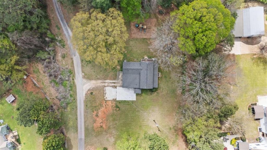 5491 Hill Road Southwest Powder Springs, GA 30127 - Photo 3 of 22 a bird view of house next to a yard