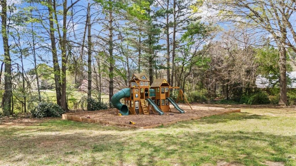 5491 Hill Road Southwest Powder Springs, GA 30127 - Photo 5 of 22 a view of outdoor space with playground and green space
