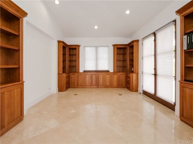 a spacious bathroom with a granite countertop tub sink and mirror