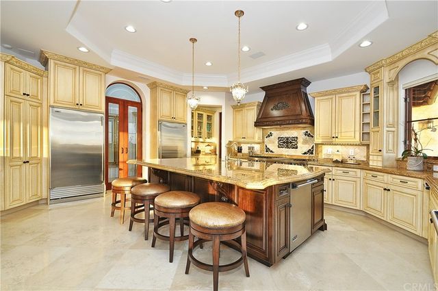 a spacious bathroom with a granite countertop double vanity sink mirror and shower