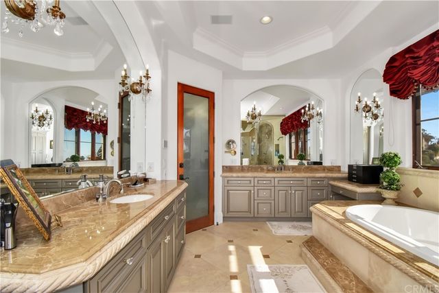 image of a room with furniture and chandelier