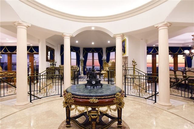 a living room with furniture a fireplace and a table