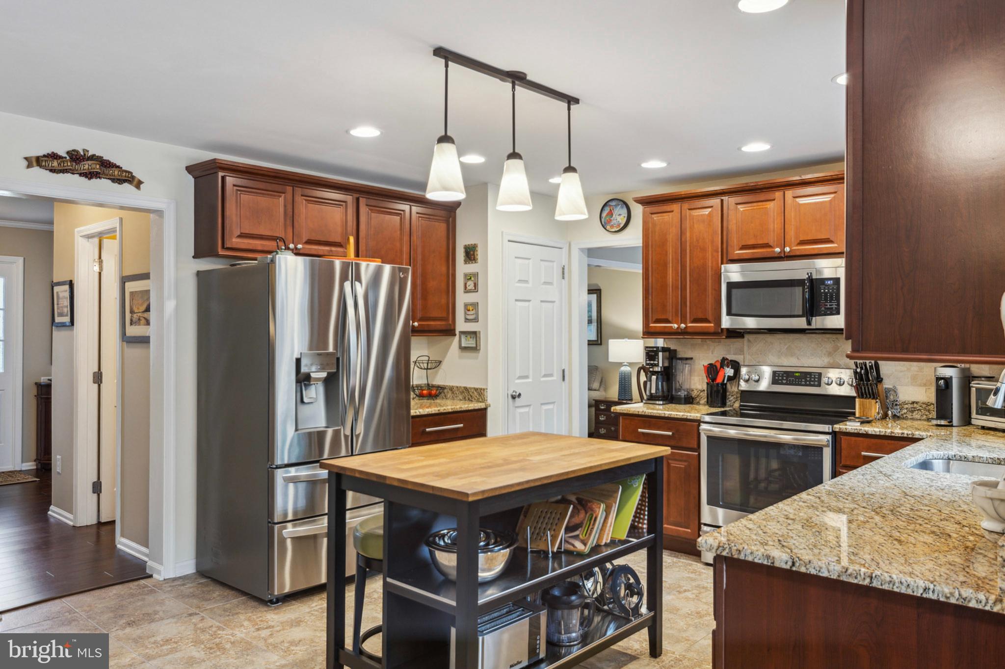 24 Oakview Drive Newark, DE 19702 - Photo 11 of 39 a kitchen with stainless steel appliances granite countertop a stove refrigerator and a sink