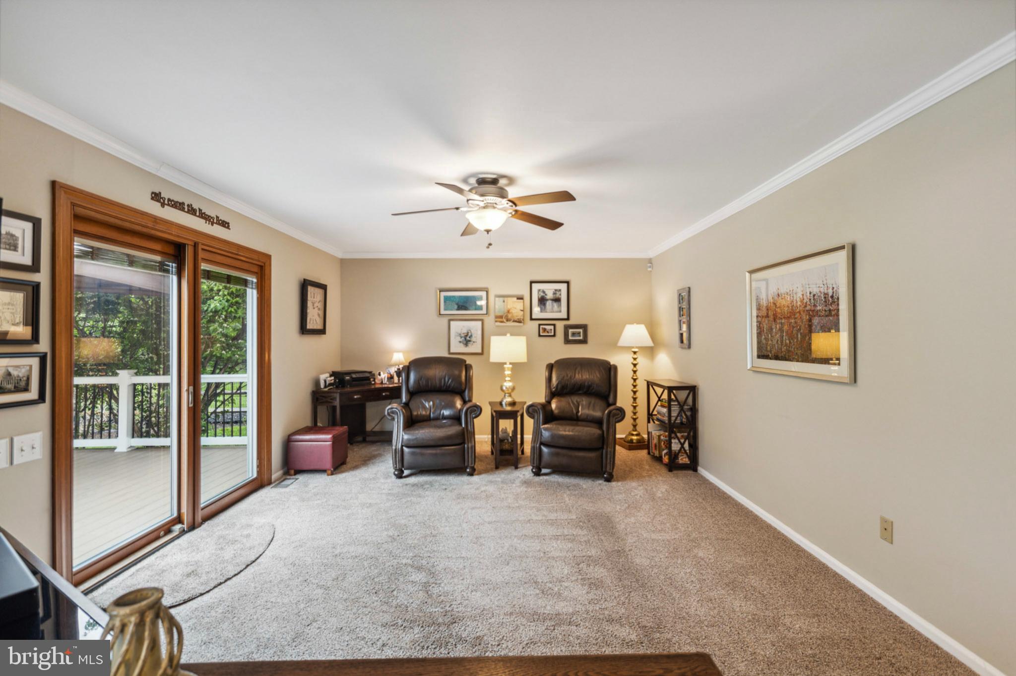 24 Oakview Drive Newark, DE 19702 - Photo 19 of 39 a living room with furniture chandelier and large window