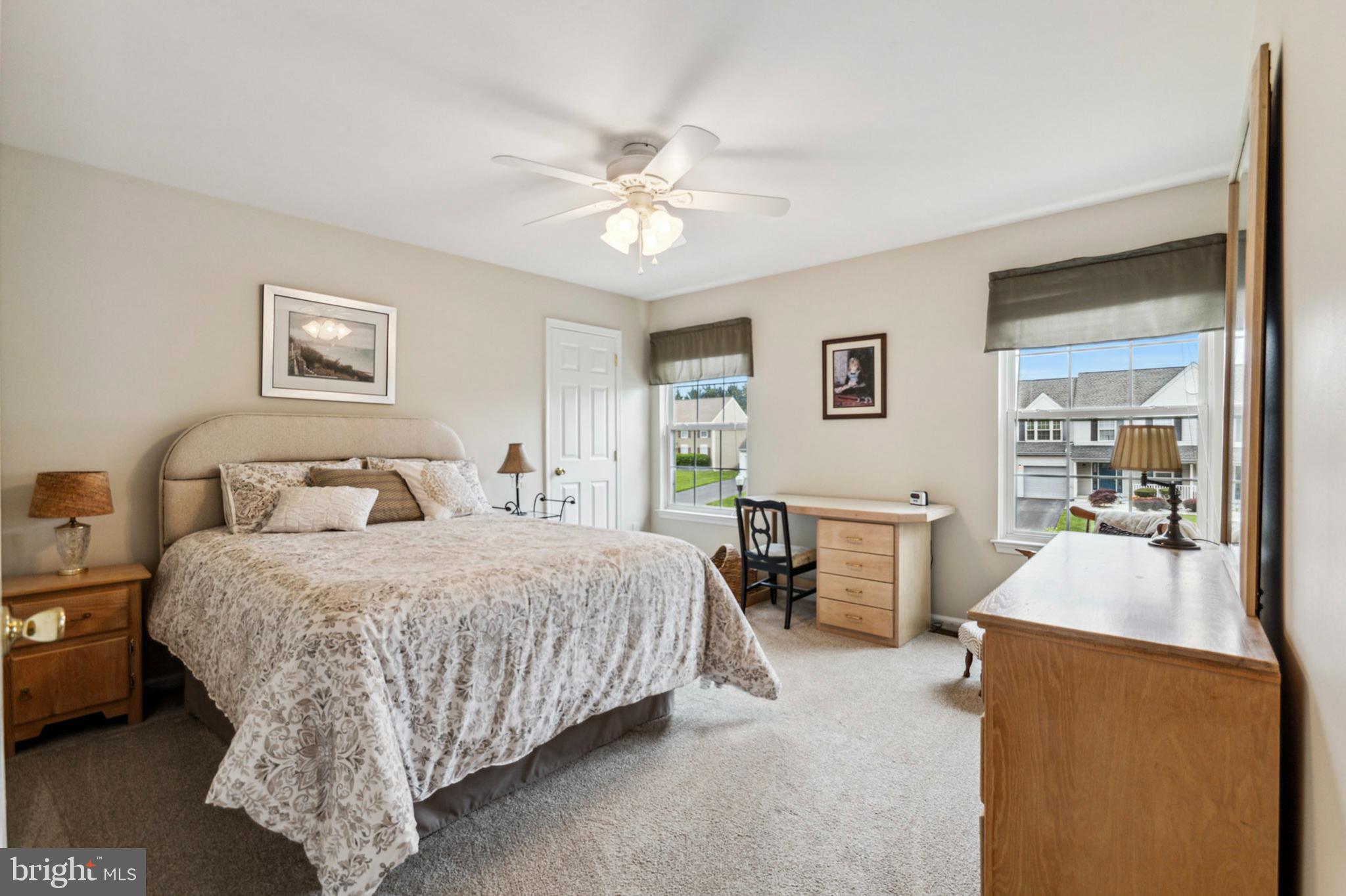 24 Oakview Drive Newark, DE 19702 - Photo 23 of 39 a bedroom with a large bed and a chandelier