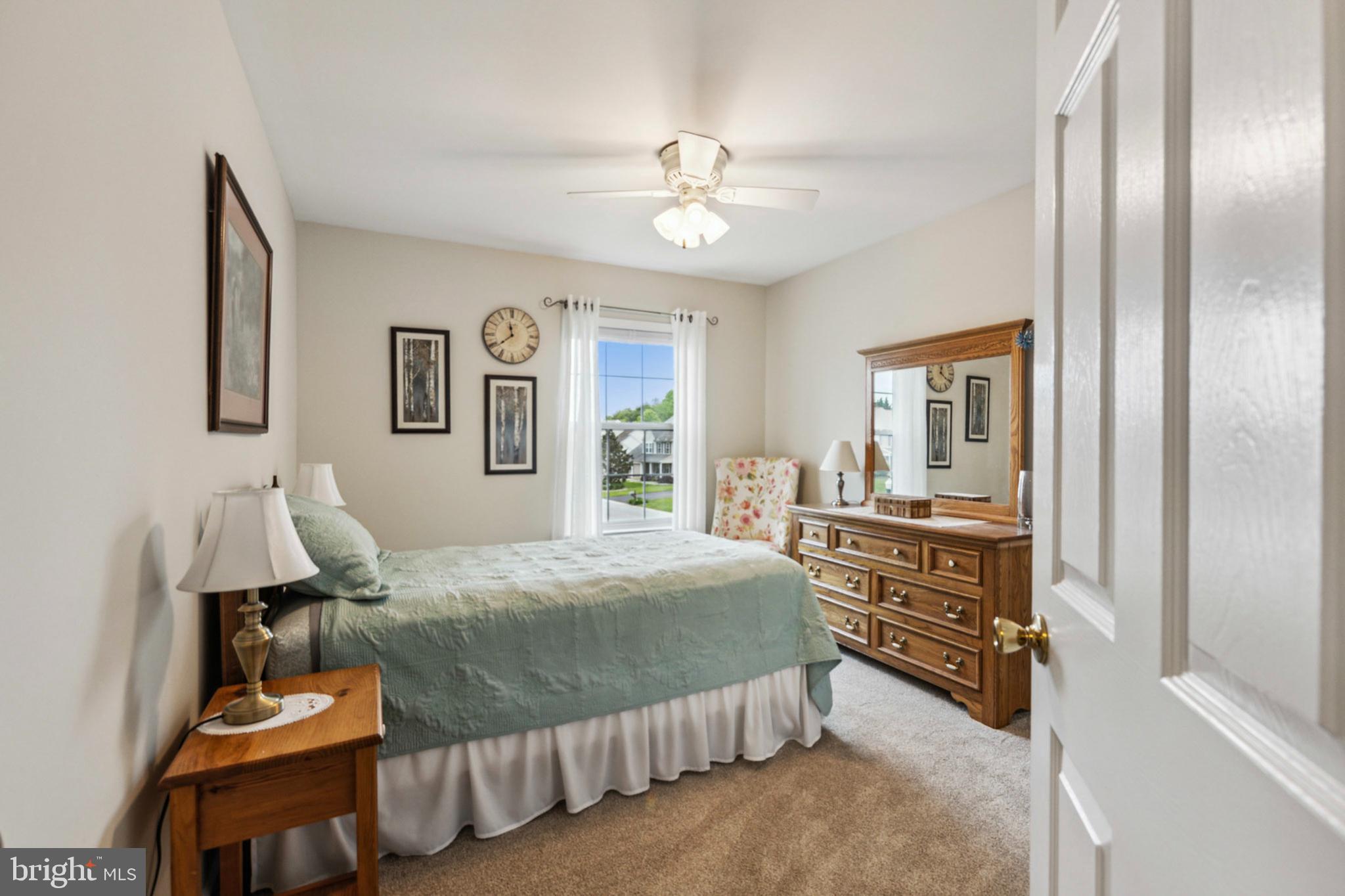 24 Oakview Drive Newark, DE 19702 - Photo 24 of 39 a bedroom with a bed and a chandelier