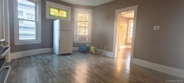 a bathroom with a shower and a glass door