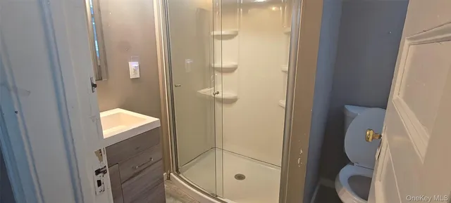 a view of entryway with window and wooden floor