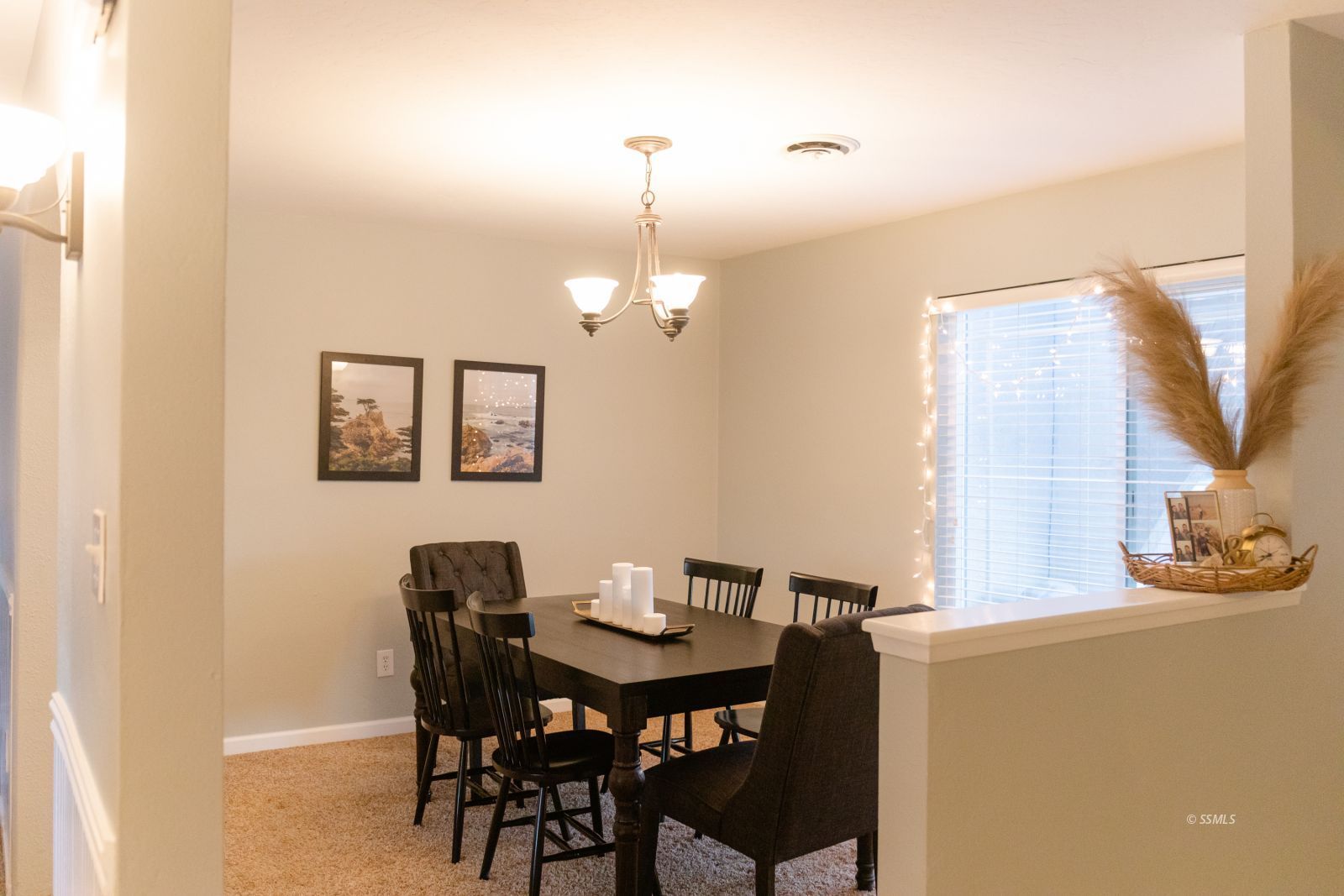 532 Las Posas Street Ridgecrest, CA 93555 - Photo 8 of 30 a view of a dining room with furniture and a chandelier