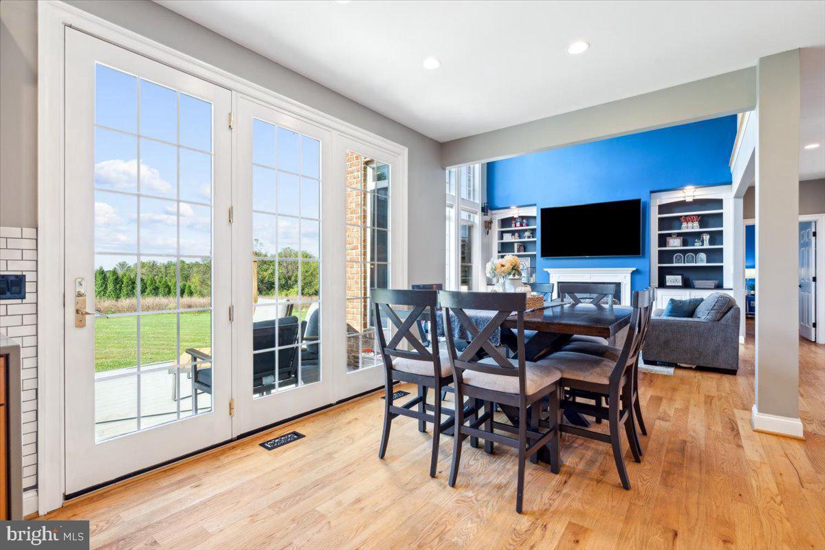 5340 Old Middletown Road Jefferson, MD 21755 - Photo 11 of 55 a view of a dining room with furniture window and wooden floor