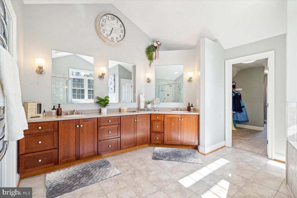 5340 Old Middletown Road Jefferson, MD 21755 - Photo 26 of 55 a spacious bathroom with a granite countertop sink and a large mirror