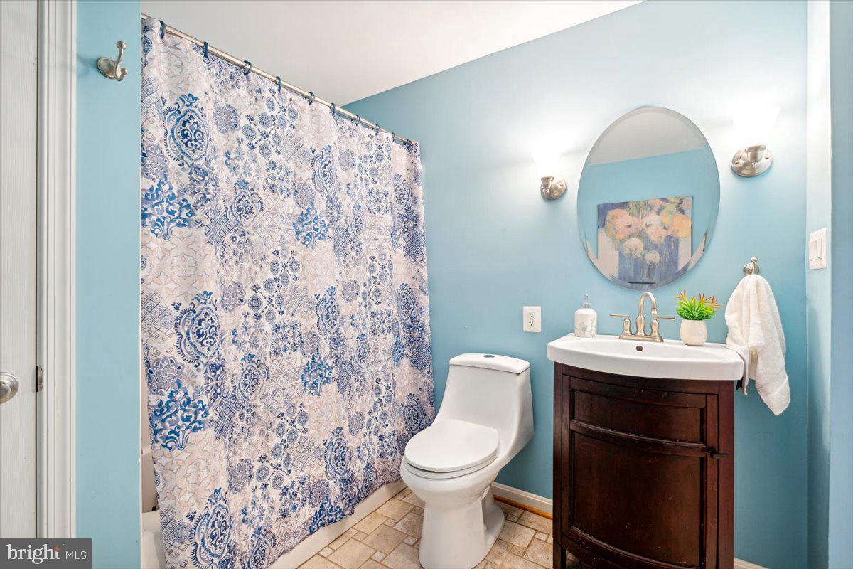 5340 Old Middletown Road Jefferson, MD 21755 - Photo 42 of 55 a bathroom with a sink toilet and mirror
