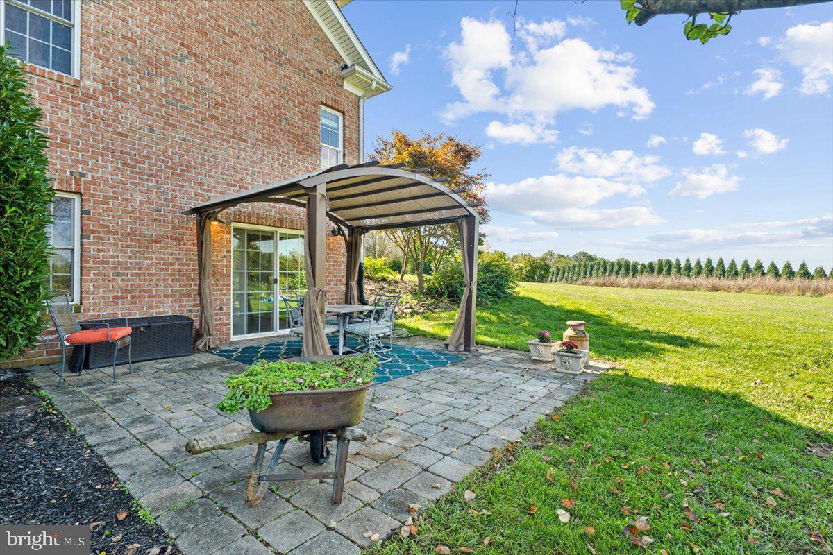 5340 Old Middletown Road Jefferson, MD 21755 - Photo 46 of 55 a view of a house with a backyard and a patio
