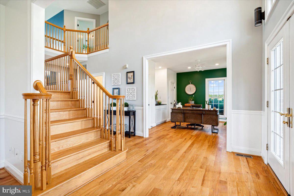 5340 Old Middletown Road Jefferson, MD 21755 - Photo 5 of 55 a view of a hallway with wooden floor and staircase