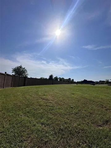 a view of an ocean and a yard