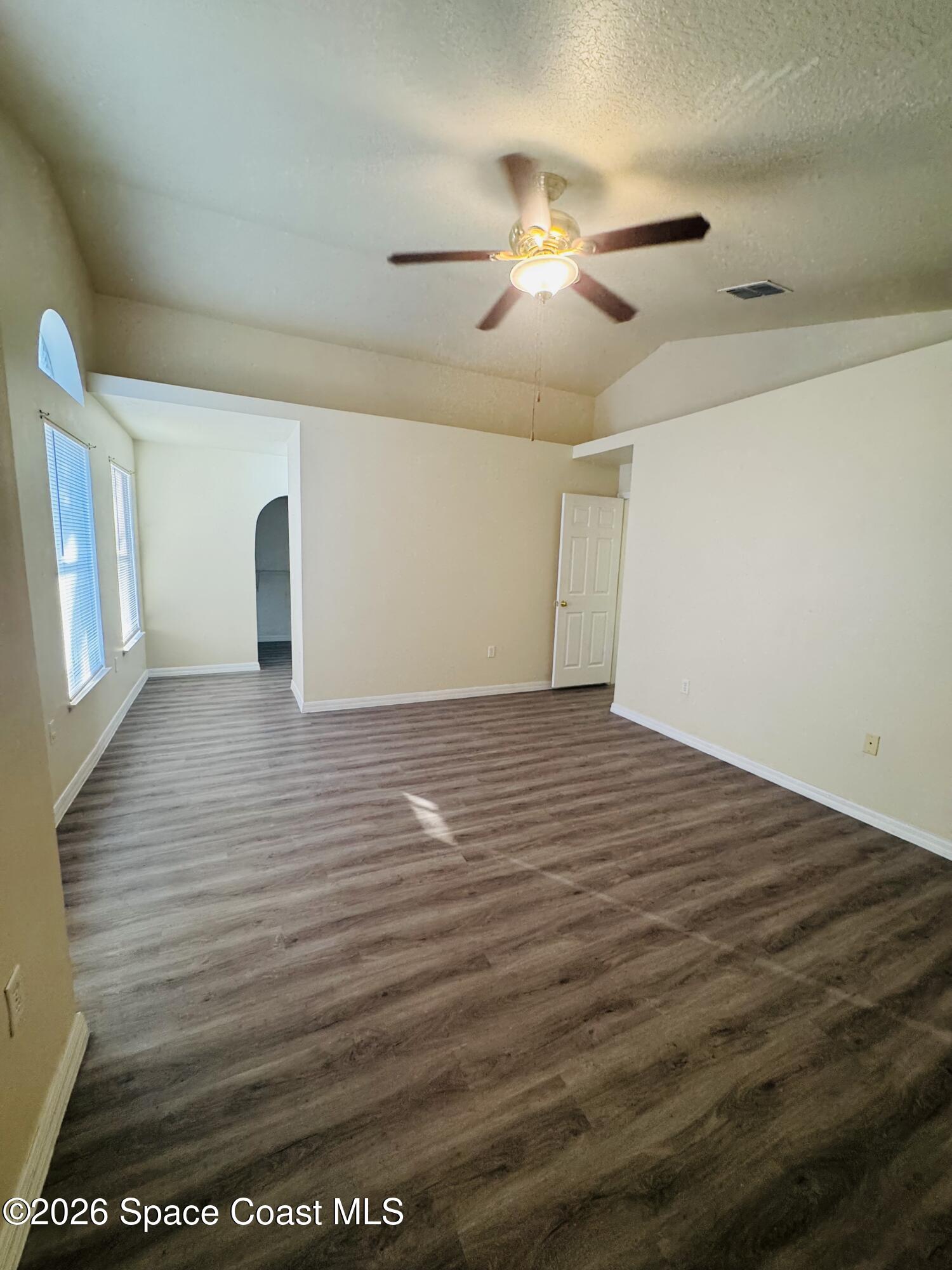 4550 Elena Way Melbourne, FL 32934 - Photo 17 of 33 a view of a livingroom with wooden floor